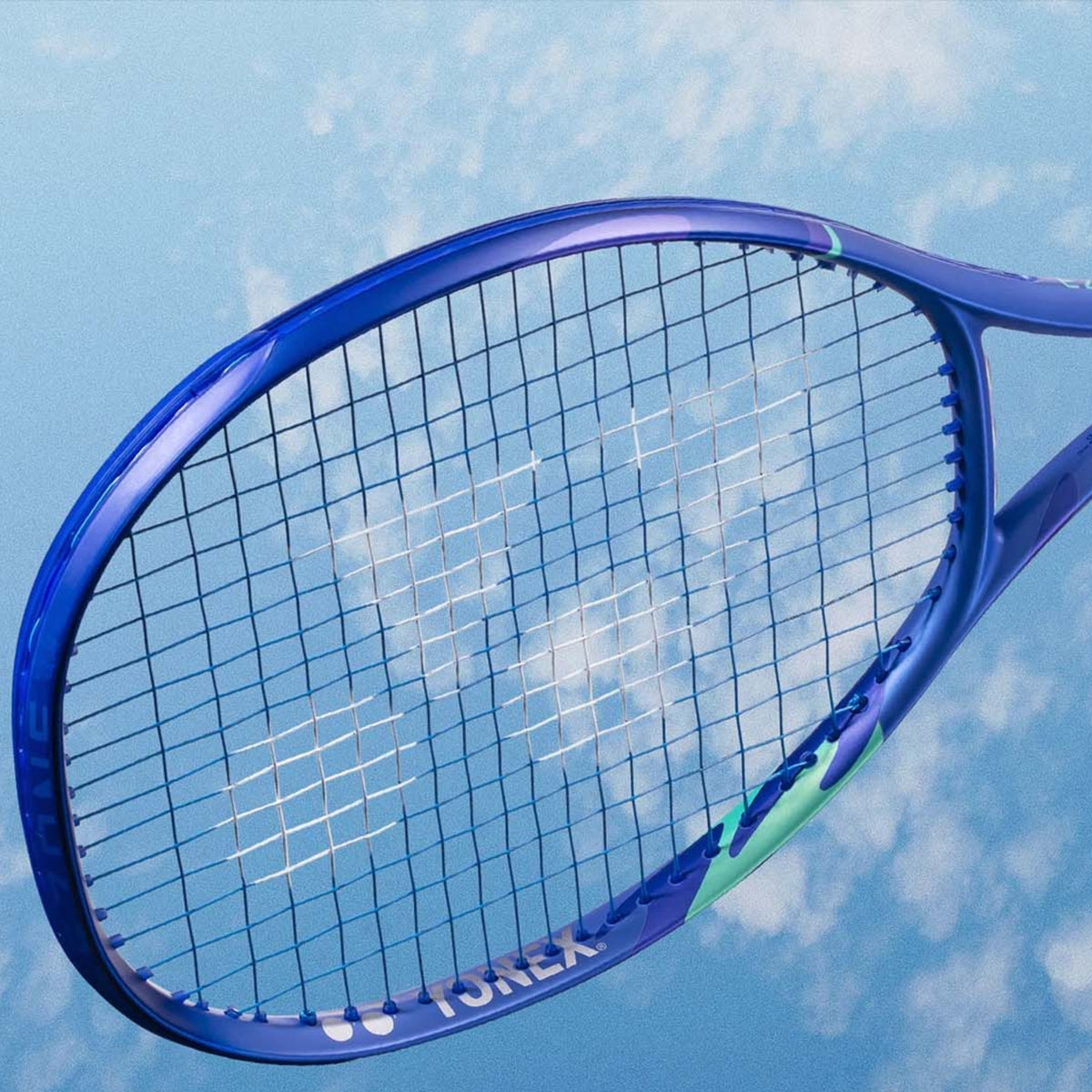 Blue tennis racket with Wilson branding against a blue sky background