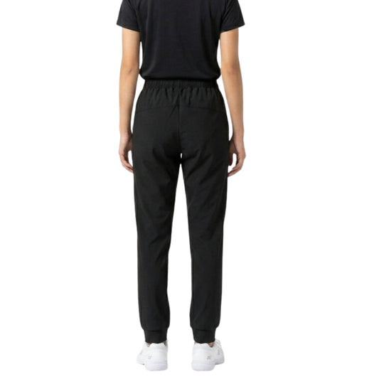 Person wearing a black outfit with pants and a shirt on a white background