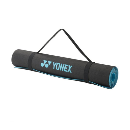 Yonex yoga mat with carrying strap on a white background