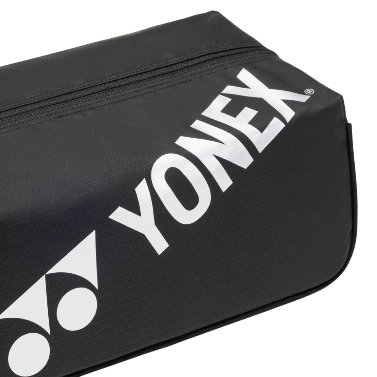 Black Yonex shoe bag with white logo on a white background