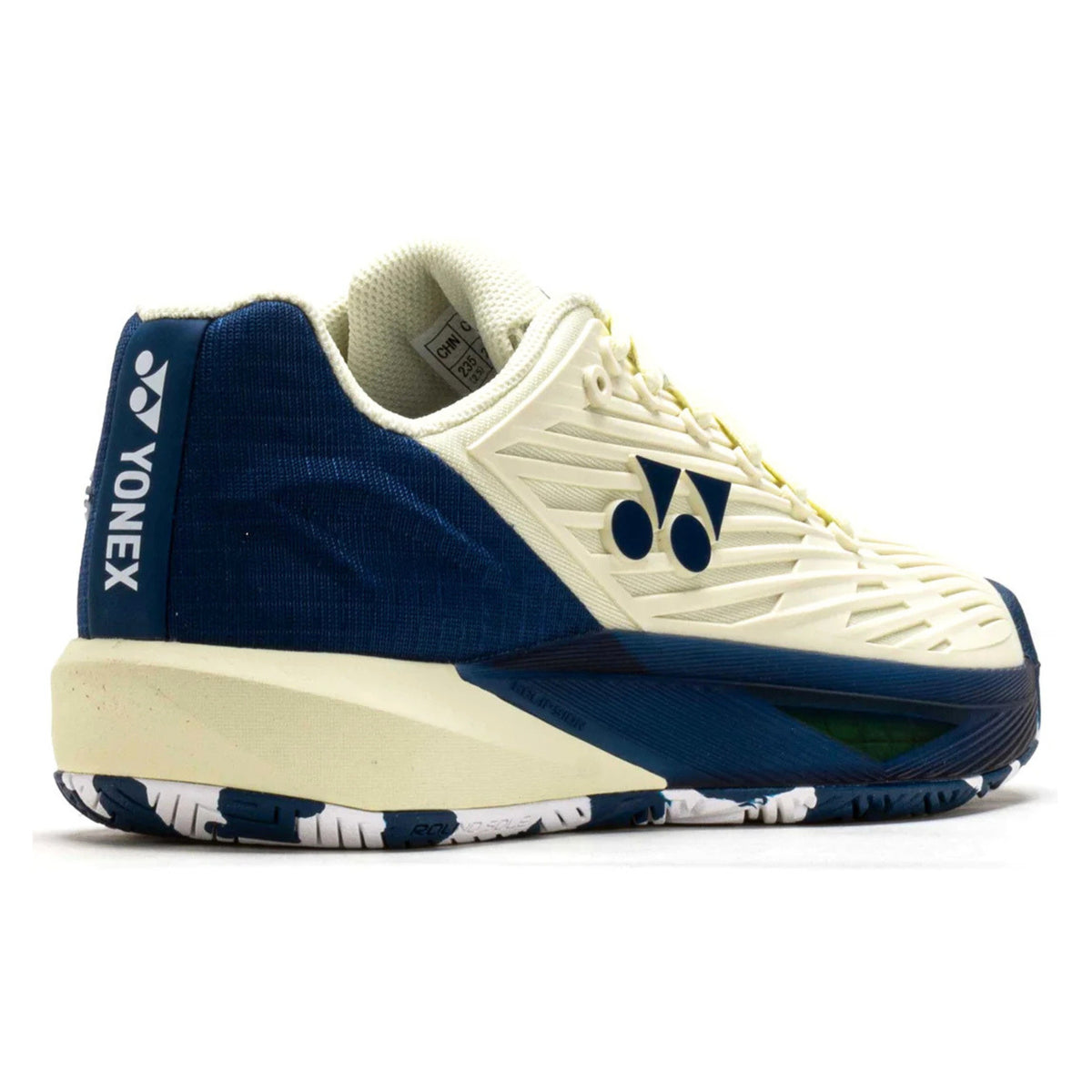 Blue and white Yonex tennis shoe with brand logo on a white background