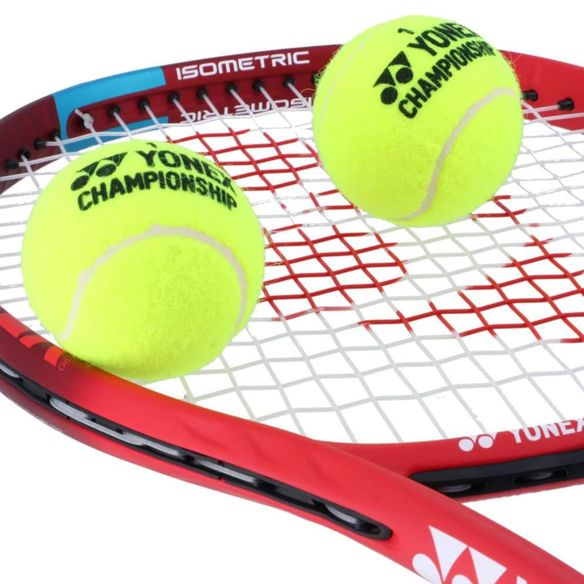 Red tennis racket with two yellow Yonex Championship tennis balls on a white background