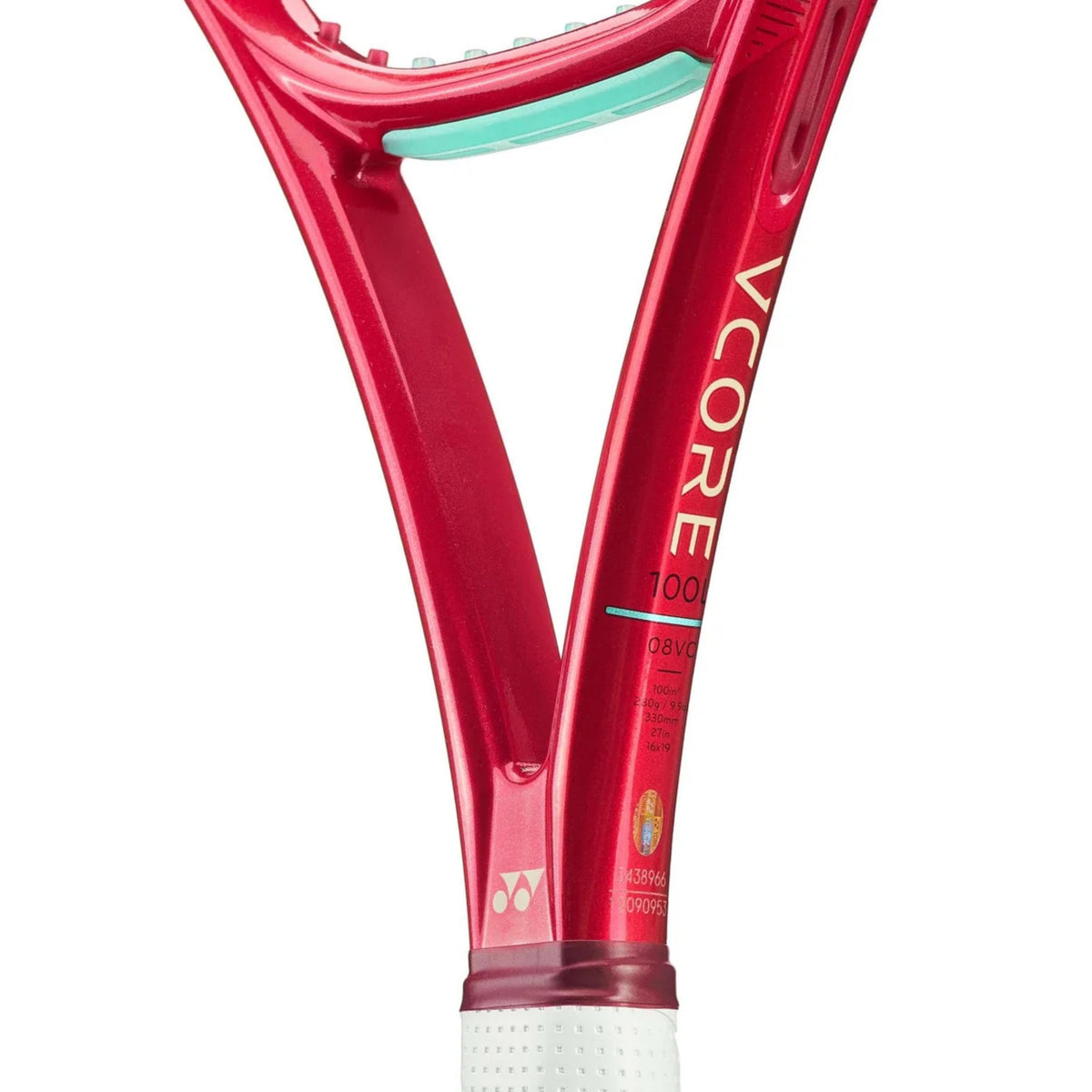 Close-up of a red tennis racket with 'Vcore' branding on a white background