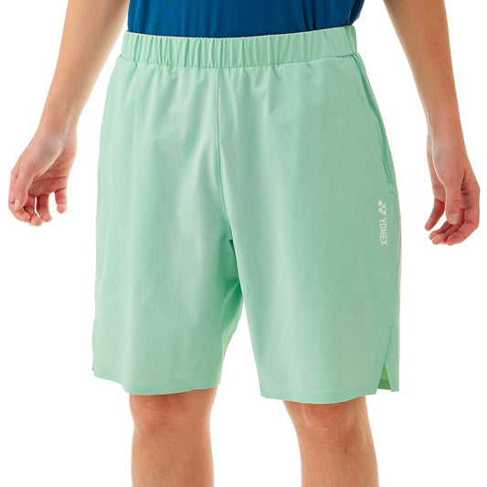 Light green shorts with a brand logo on a white background