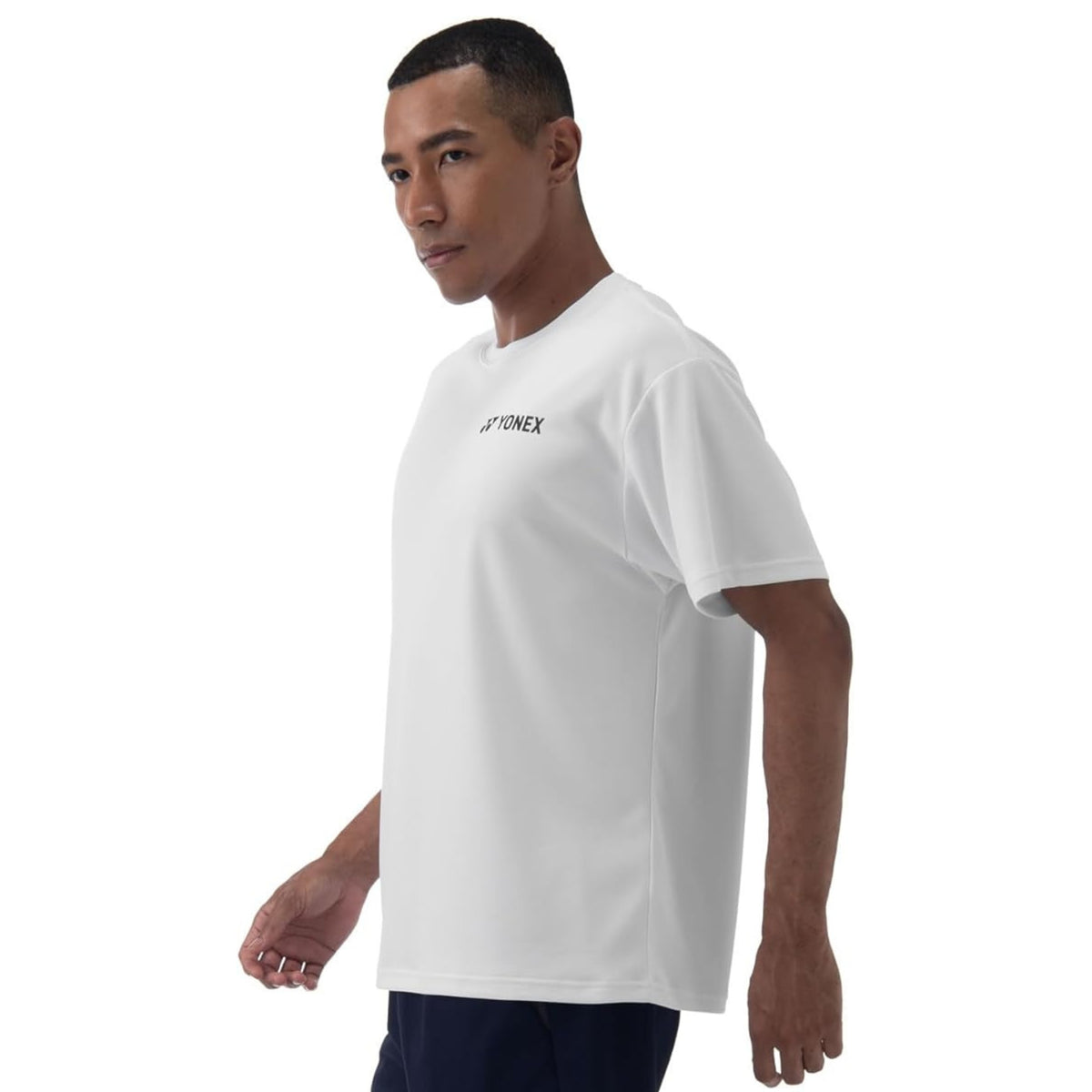 Man wearing a white t-shirt with a brand logo on a white background