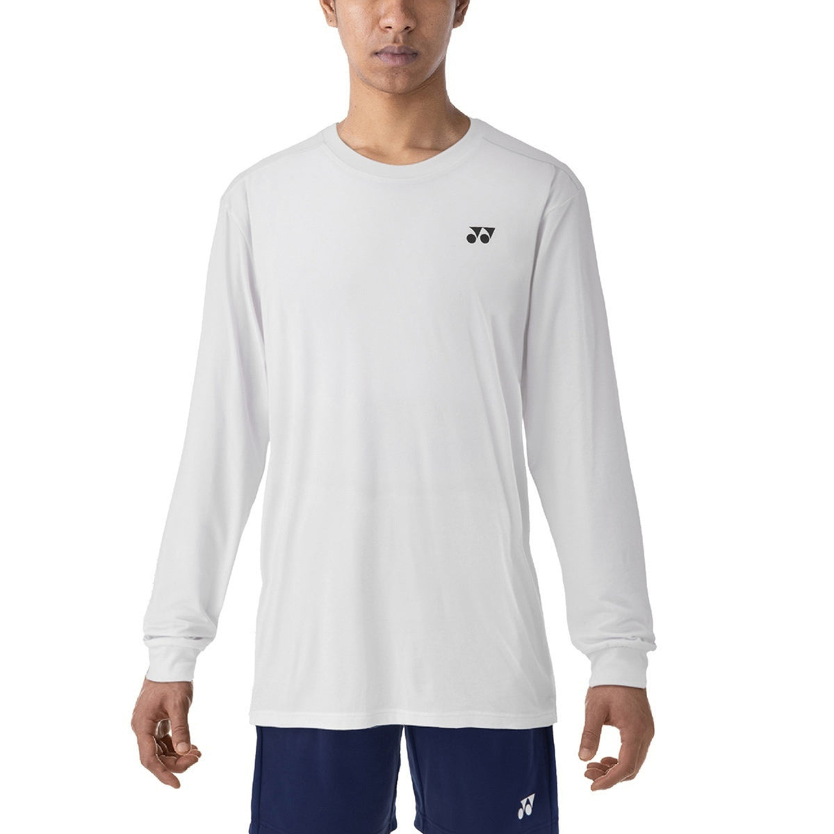 Person wearing a white long-sleeve shirt with a logo on a white background