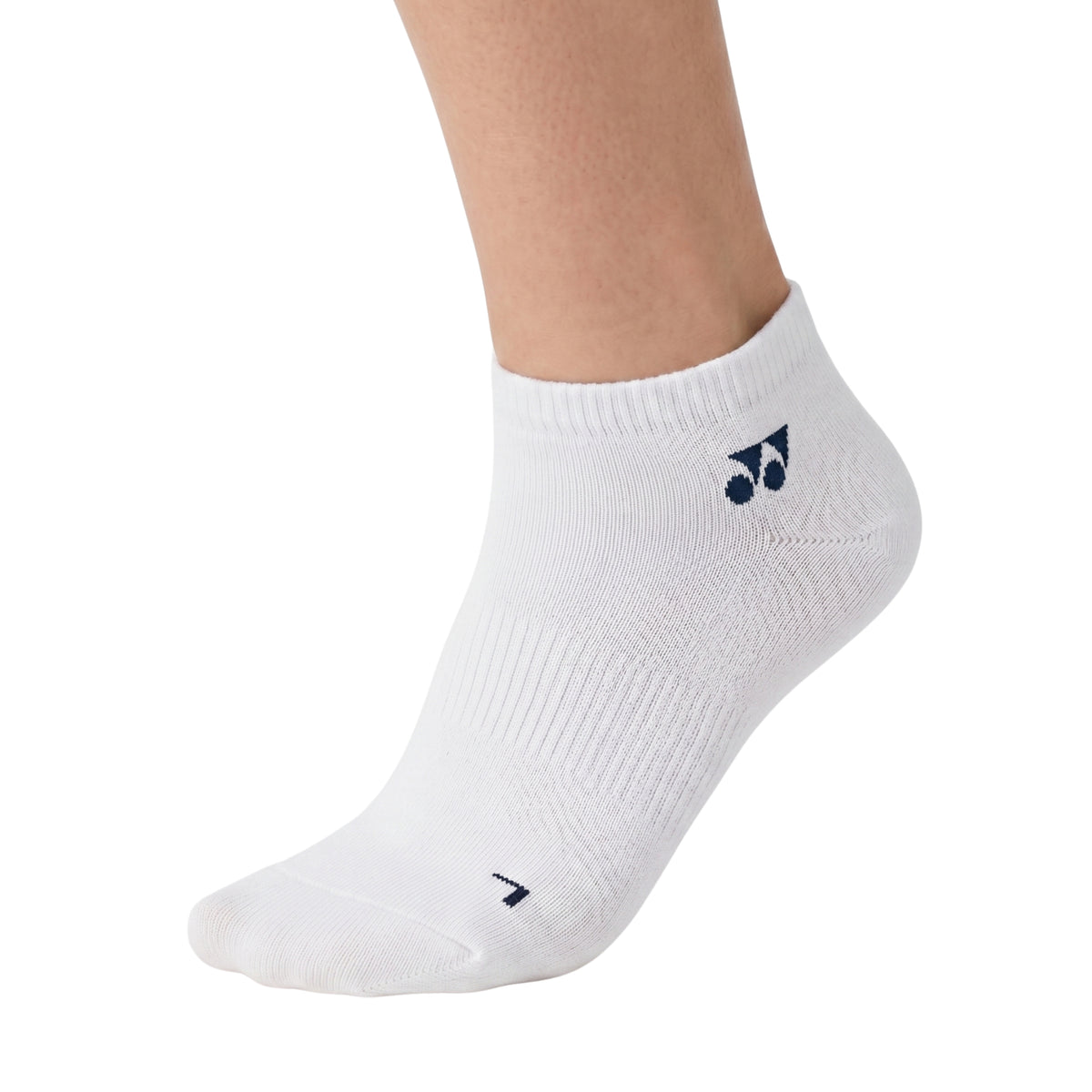 Person wearing a white ankle sock with a logo on a white background