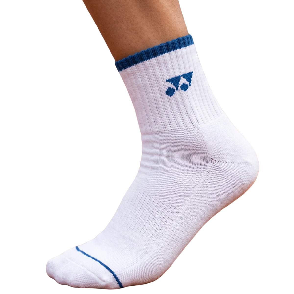 Junior wearing white sock with blue trim on a white background