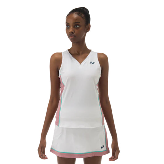 Woman wearing a white and pink athletic outfit with a brand logo on a white background