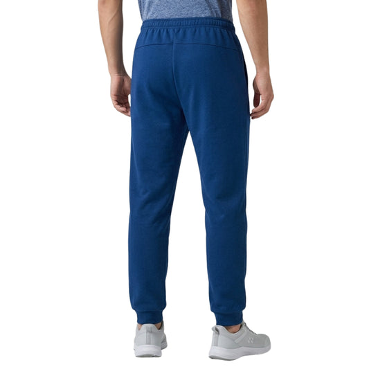 Person wearing blue sweatpants on a white background