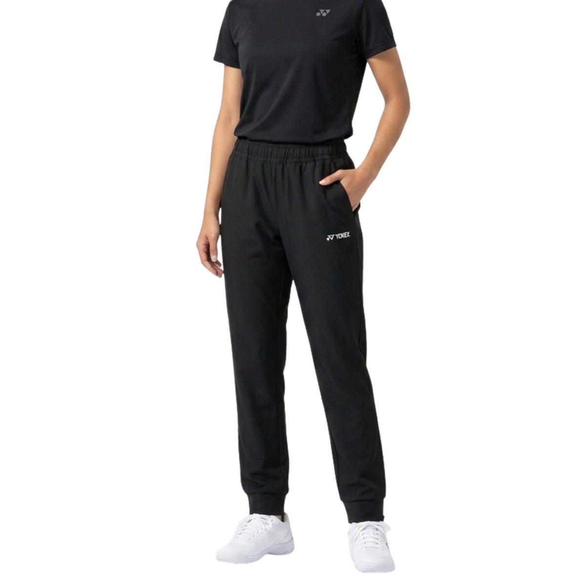 Person wearing black tracksuit with brand logo on a white background