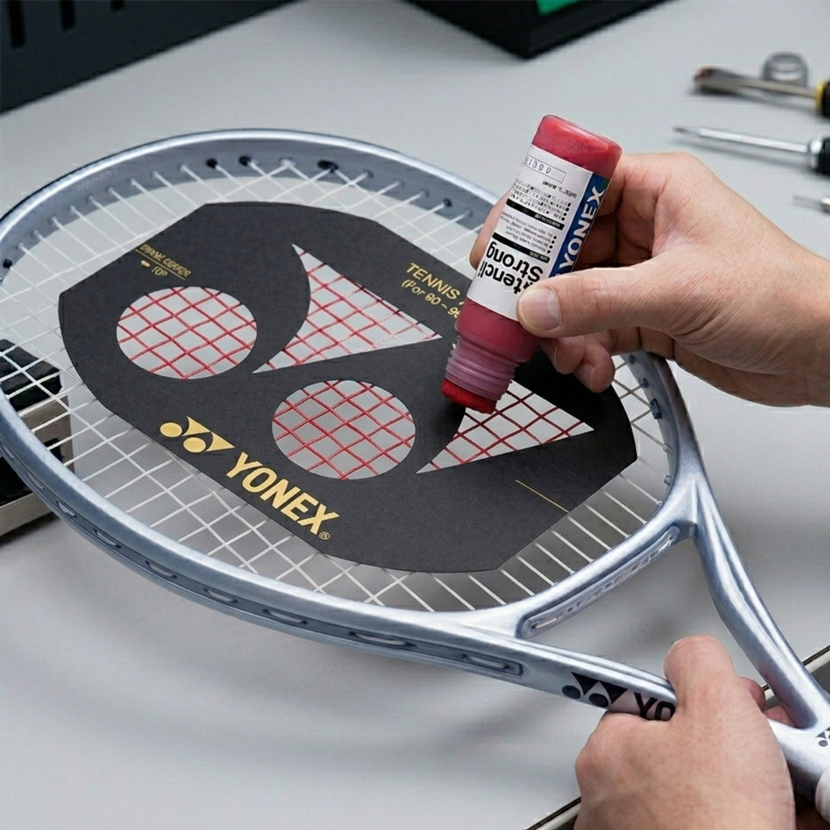 Person usin ink stencil on a surface