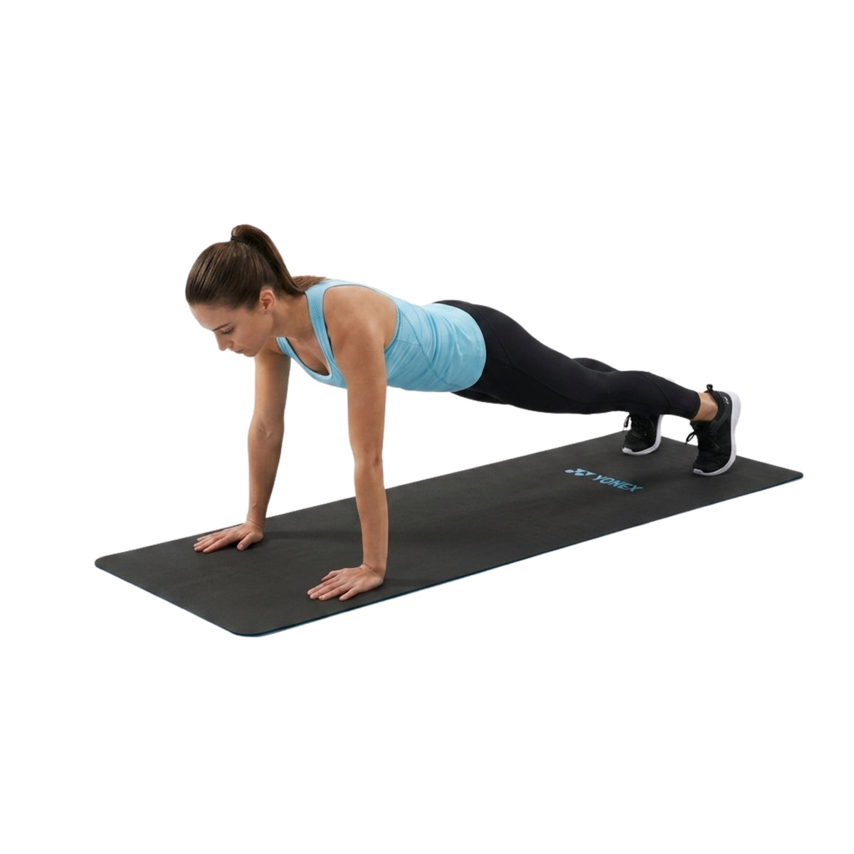 Person using a Yonex yoga mat on a white background