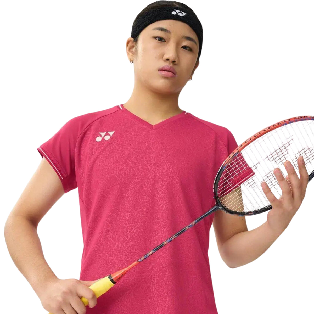 Person wearing a red sports shirt holding a badminton racket on a white background