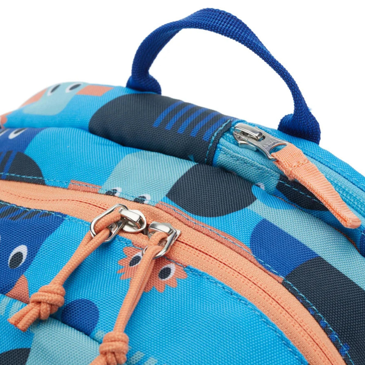 Close-up of a blue children's backpack with zippers and cartoon character design.