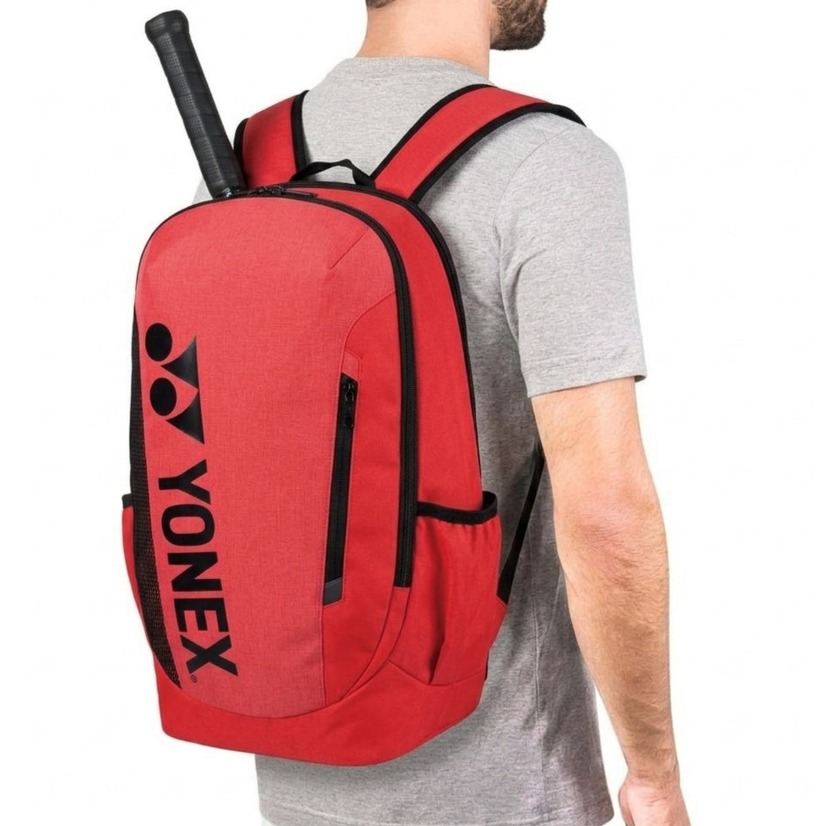 Red Yonex backpack with a person wearing it on a white background