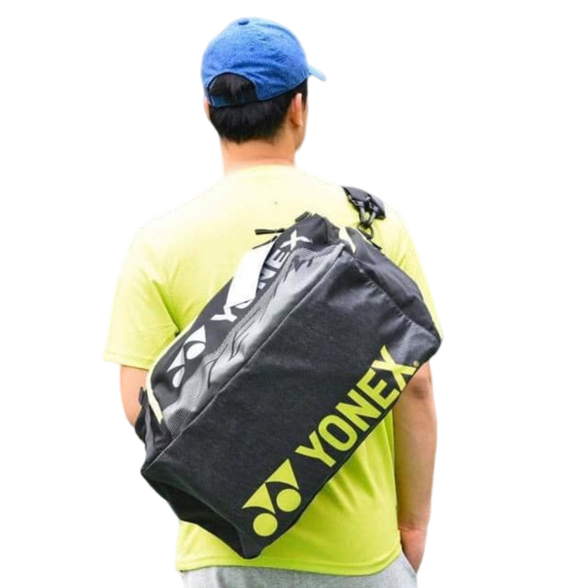 Person wearing a Yonex bag over one shoulder on a white background