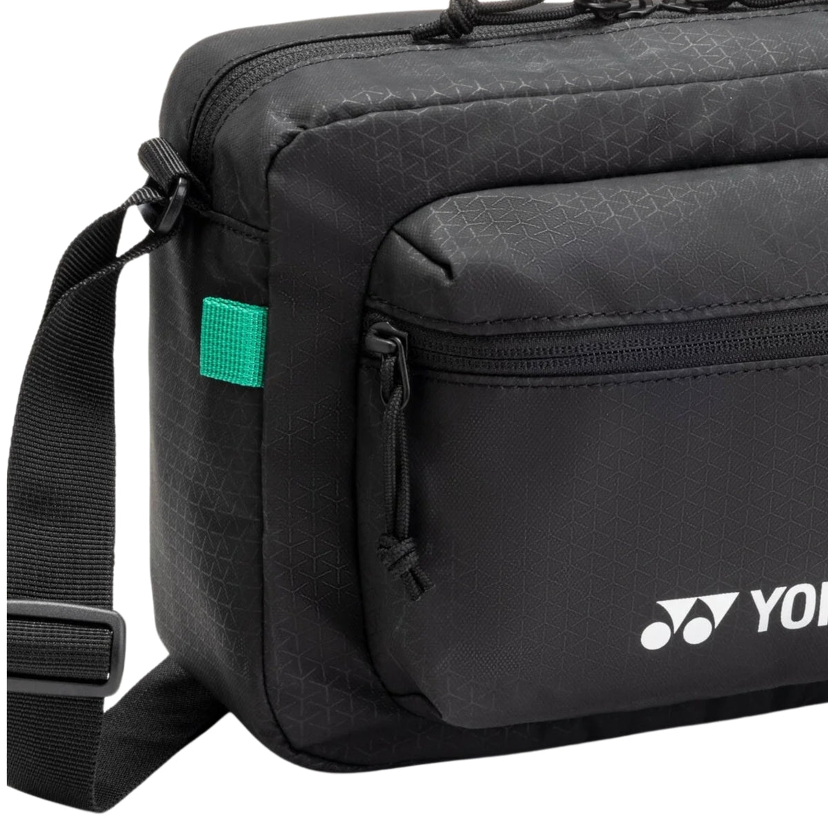 Black shoulder bag with a visible brand logo on a white background