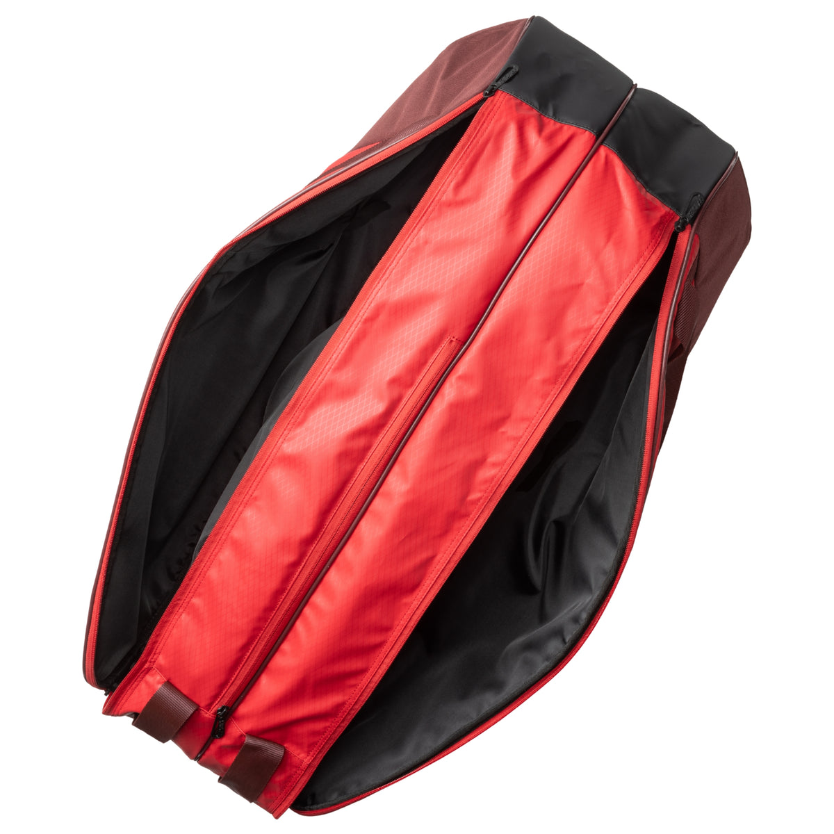 Red and black tennis bag with open front compartment on a white background