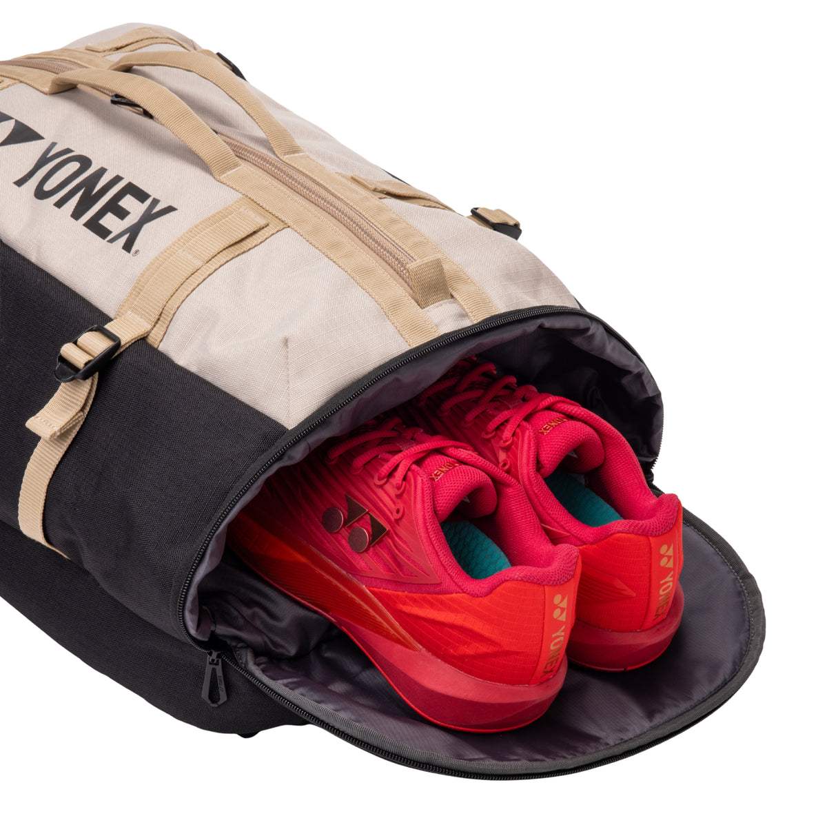 Yonex backpack with red sports shoes inside on a white background
