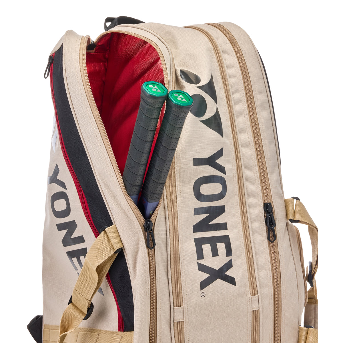 Yonex tennis bag with racket handles sticking out on a white background