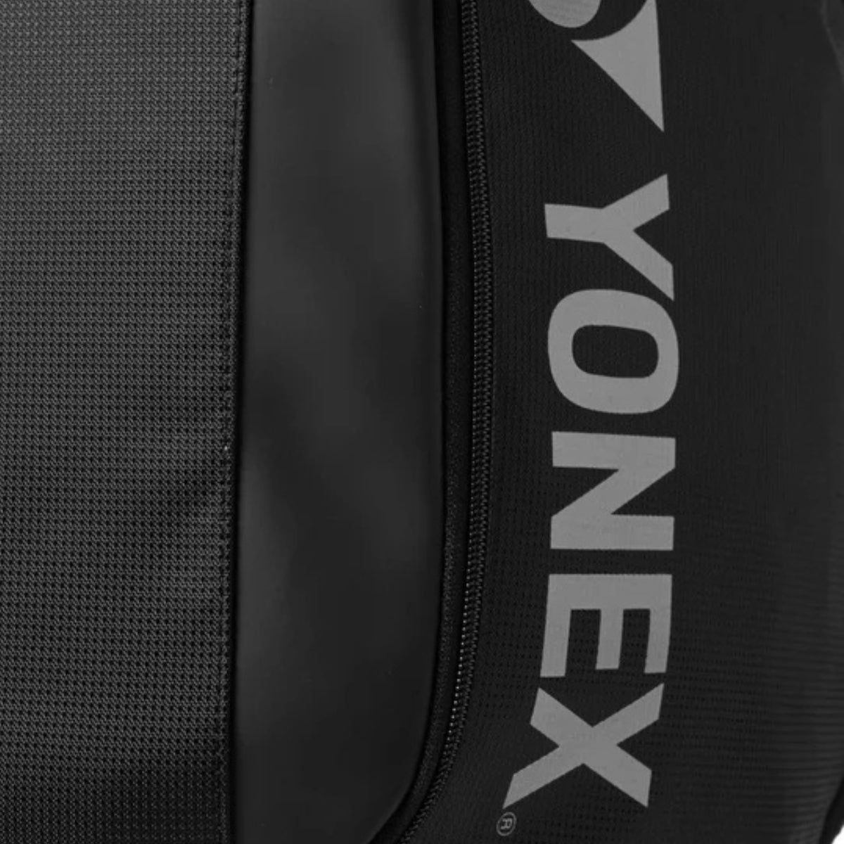 Black backpack with Yonex branding on a gray background