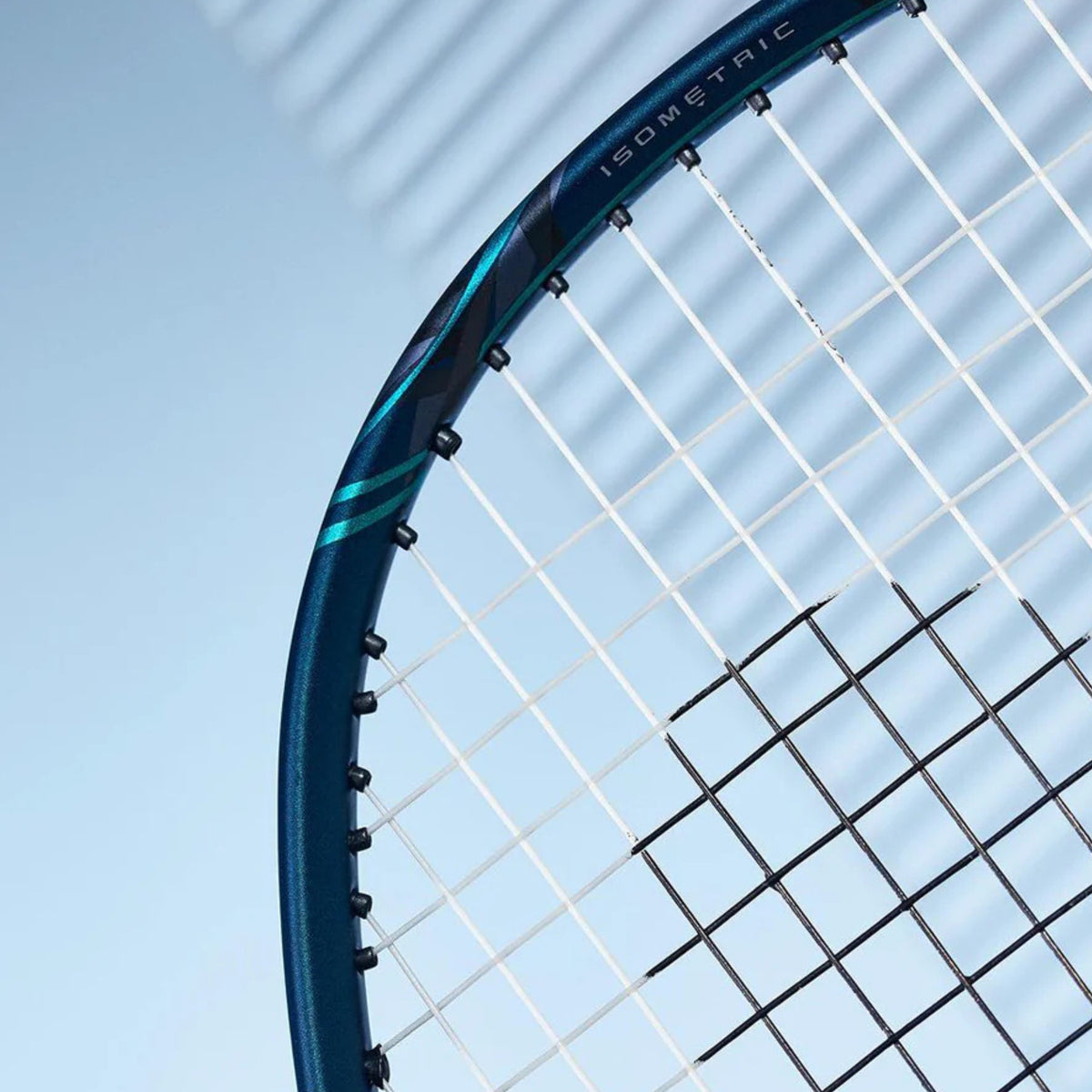Close-up of a blue badminton racket with a clear sky background