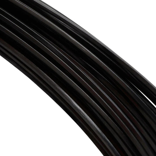 Close-up of a black tennis string reel with branding on a white background