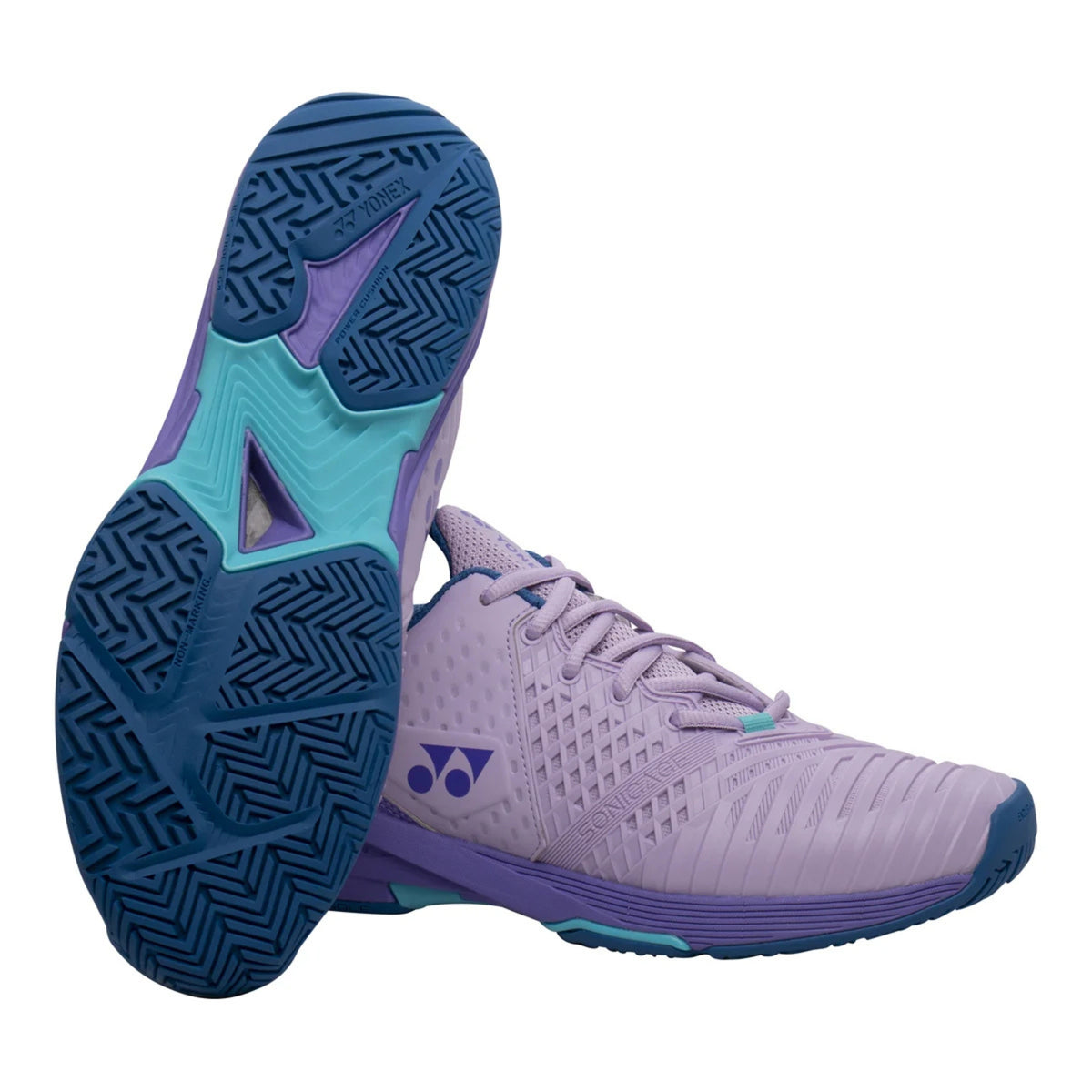 Purple and blue tennis shoe with a focus on sole texture