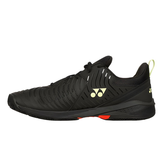 Black Yonex tennis shoe with brand logo on a white background