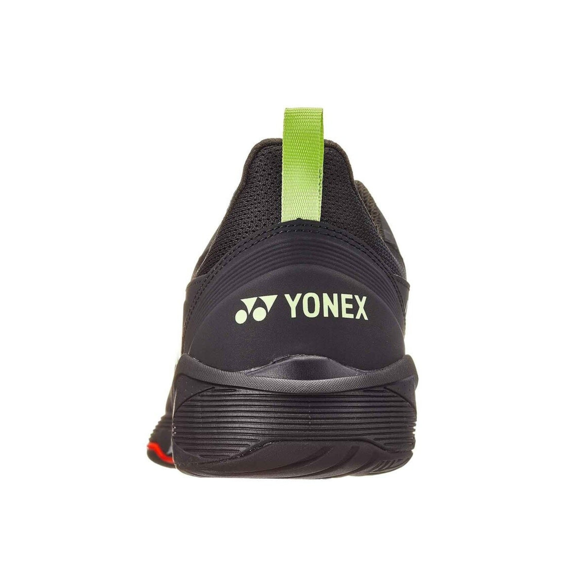 Black Yonex tennis shoe with a green tag on a white background