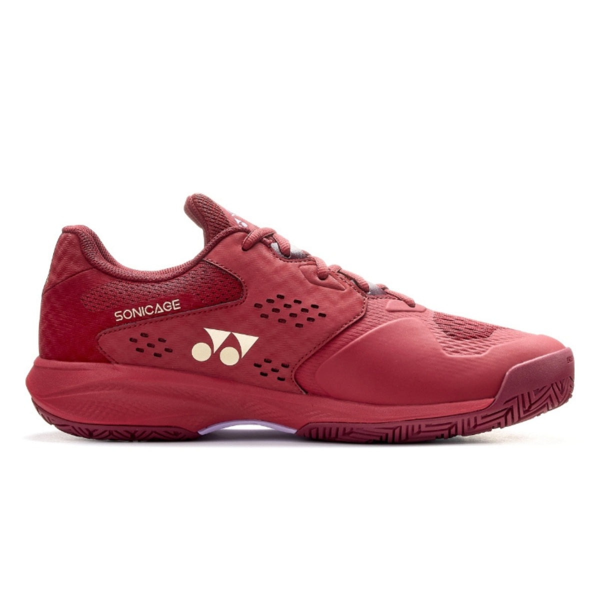 Red Yonex tennis shoe with a brand logo on a white background