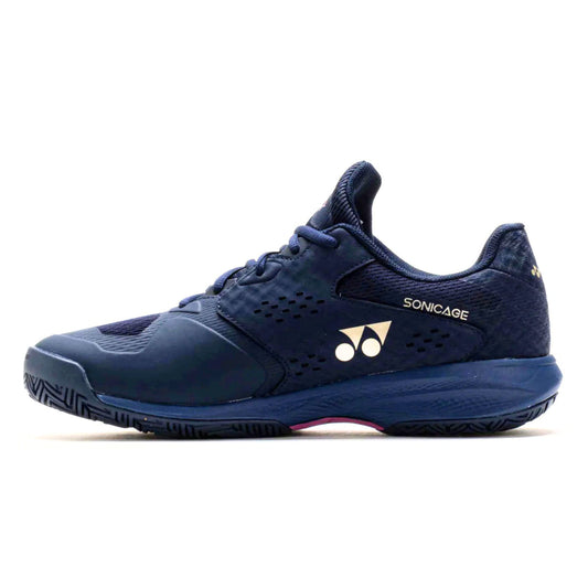 Navy blue Yonex tennis shoe with brand logo on a white background