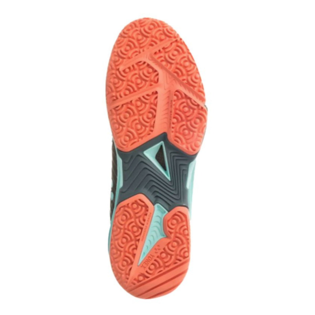 Close-up of a shoe sole with orange tread pattern on a white background