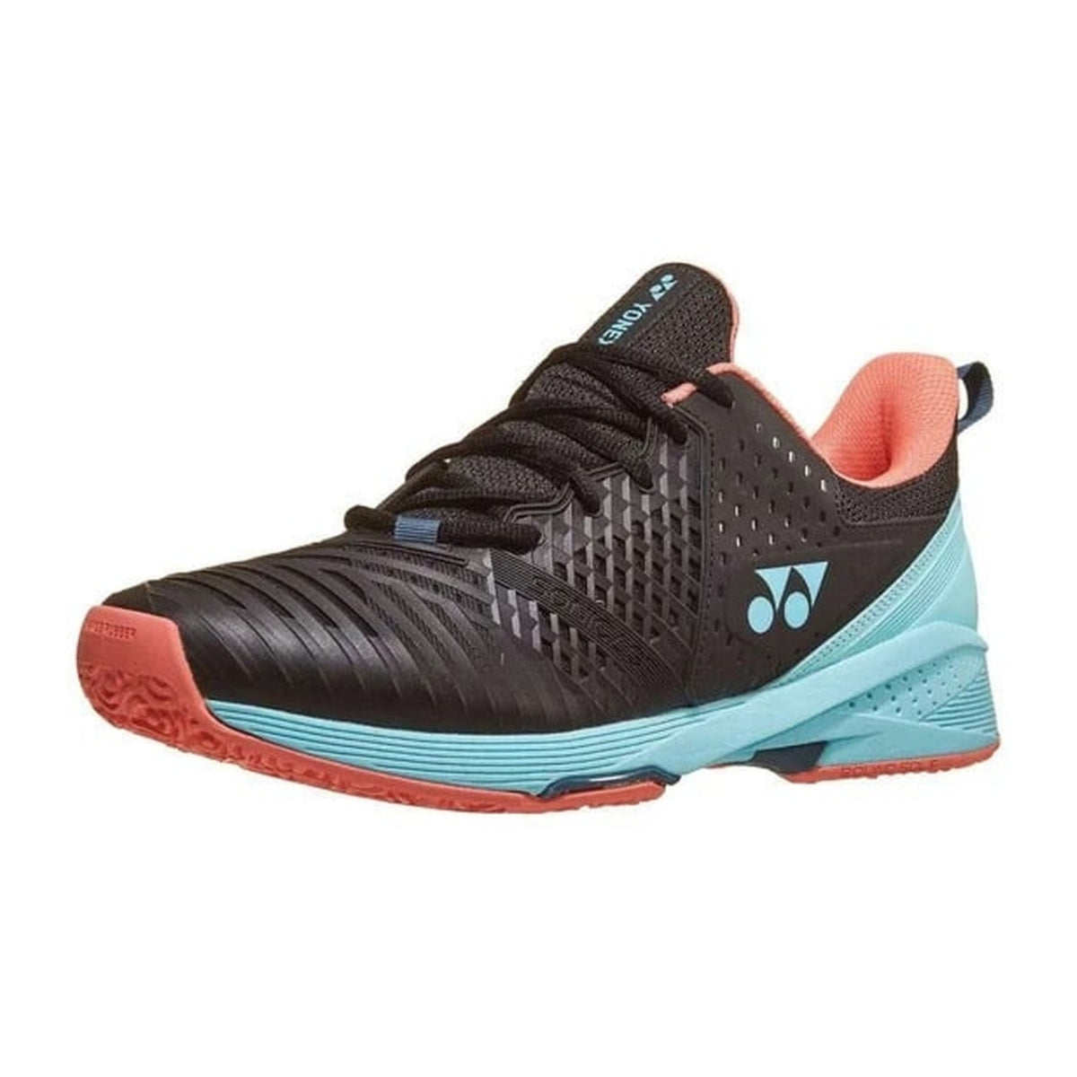 Black Yonex tennis shoe with orange and blue sole on a white background