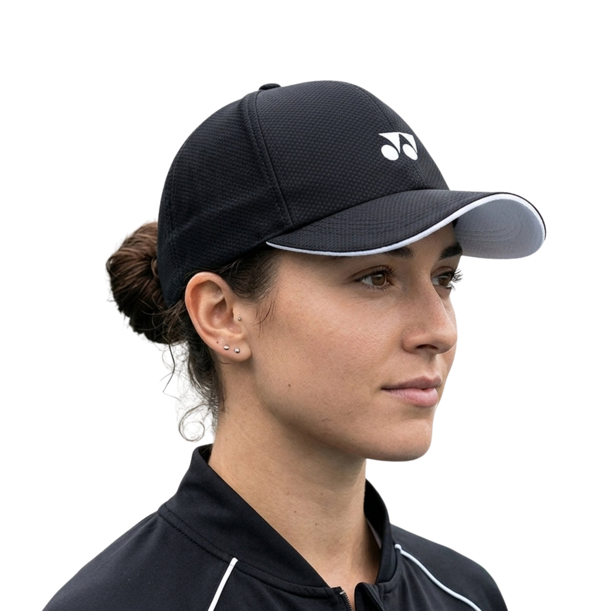 Woman wearing a black cap with a logo on a white background