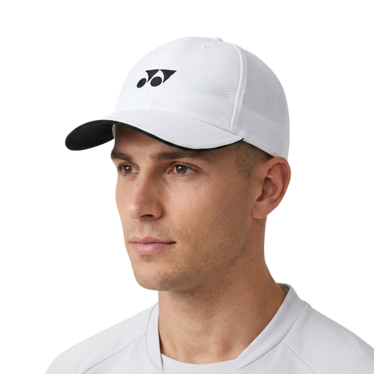 Man wearing a white cap with a logo on a white background