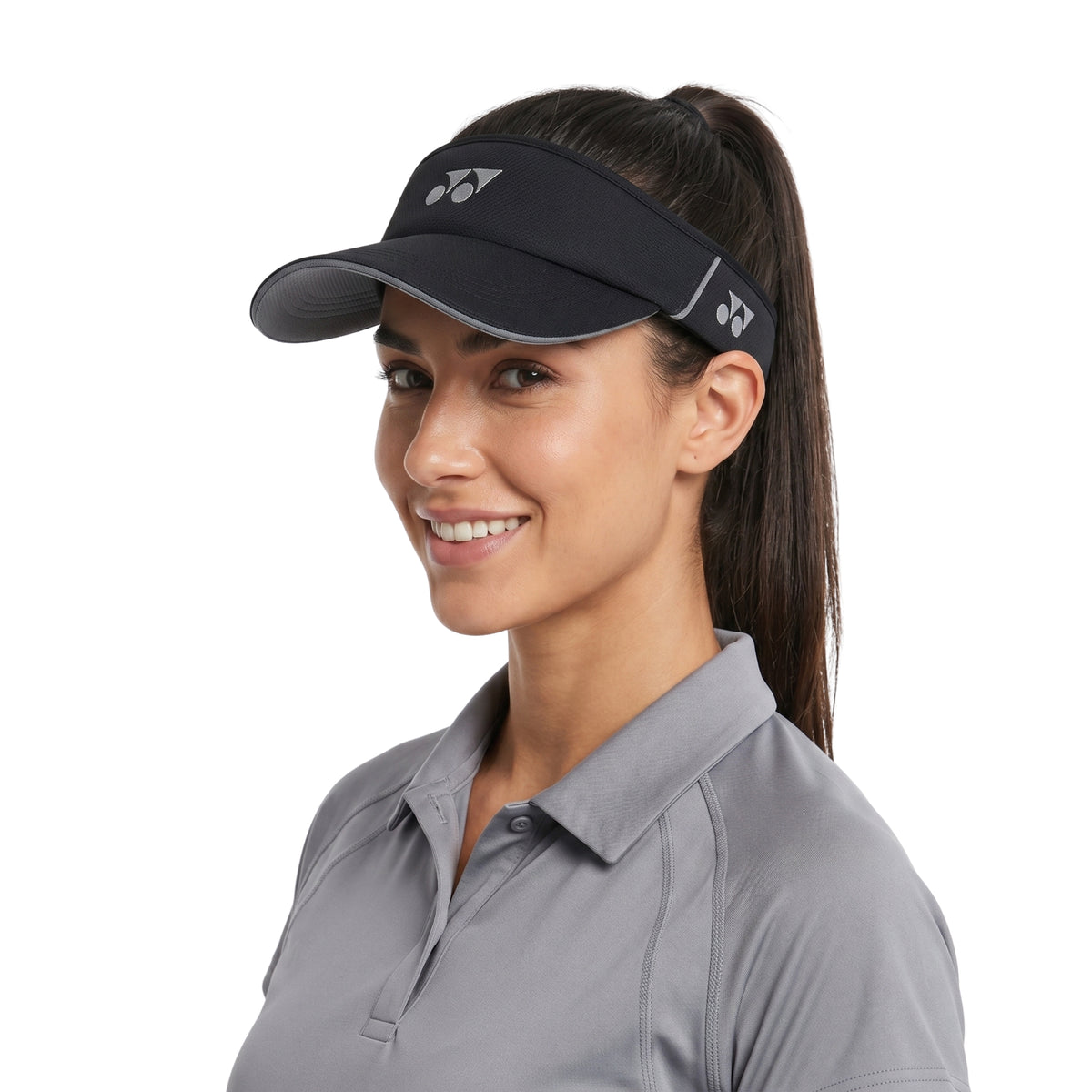 Woman wearing a black visor with a white background