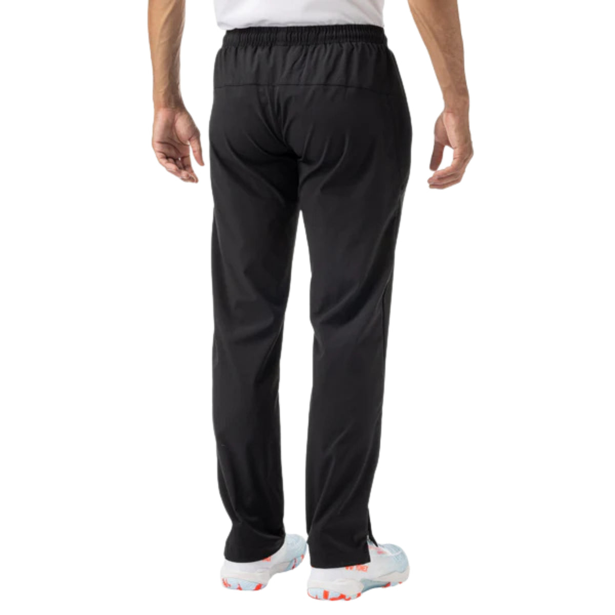 Person wearing black athletic pants on a white background