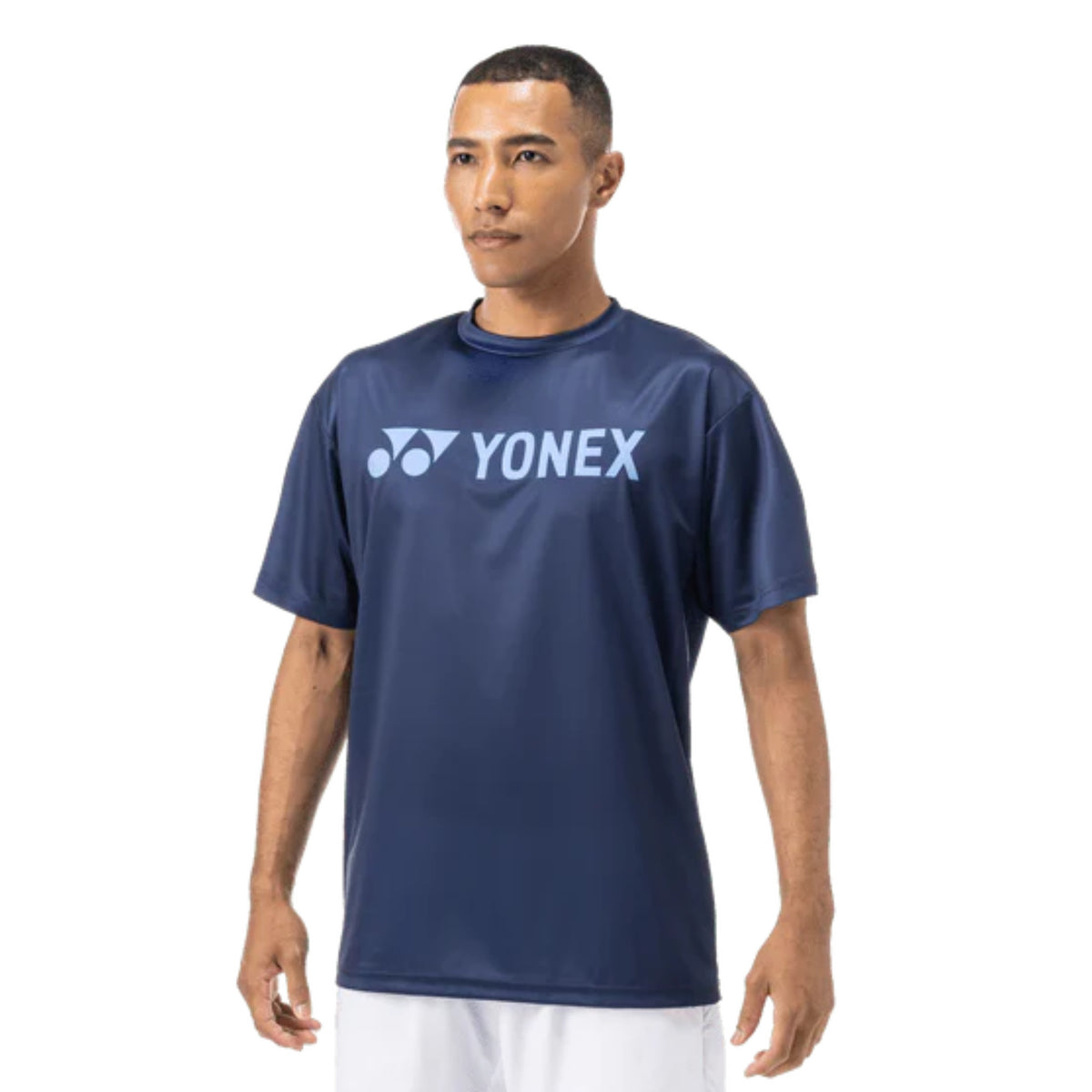Man wearing a navy blue Yonex t-shirt on a white background
