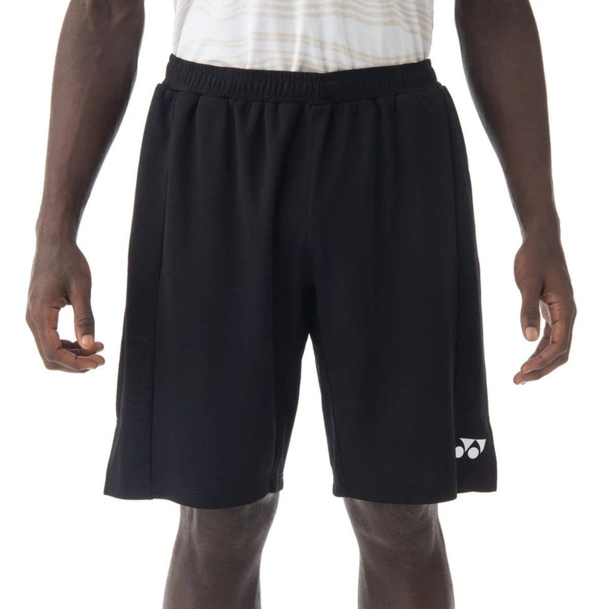 Black shorts with a brand logo on a white background